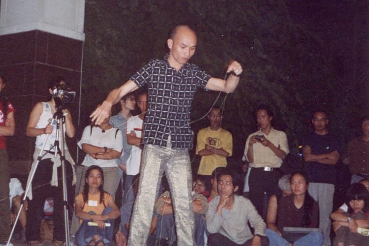 Performance by artist Trương Tân in the front yard British Council.